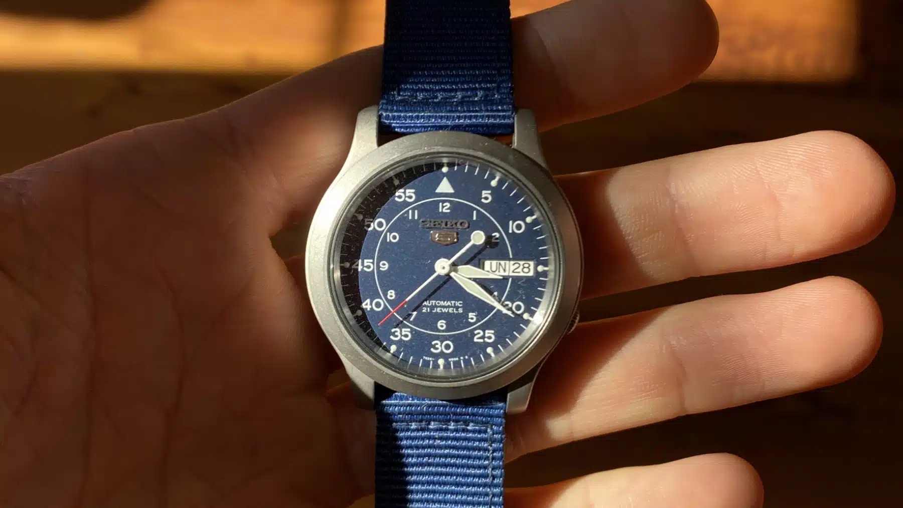 Silver watch discount with blue dial