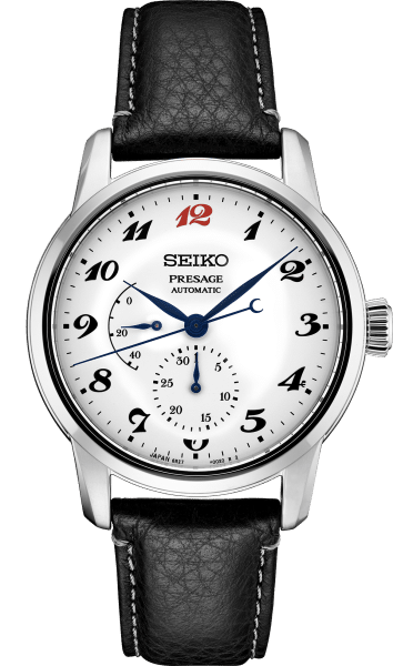 Seiko SPB401 watch with black leather strap, white face and blue and red accents.