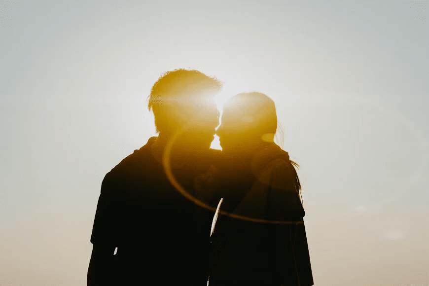 A man holding and pulling his partner closer to himself.