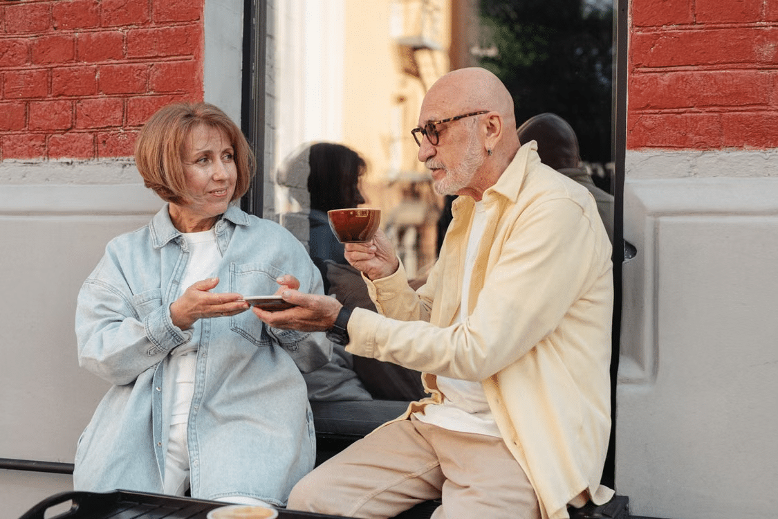 An elderly couple having a deep conversation.