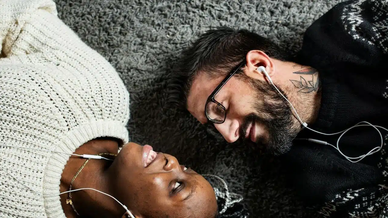 A couple listening to music together.