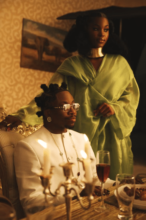 A couple dressed elegantly flaunting their money at a party.