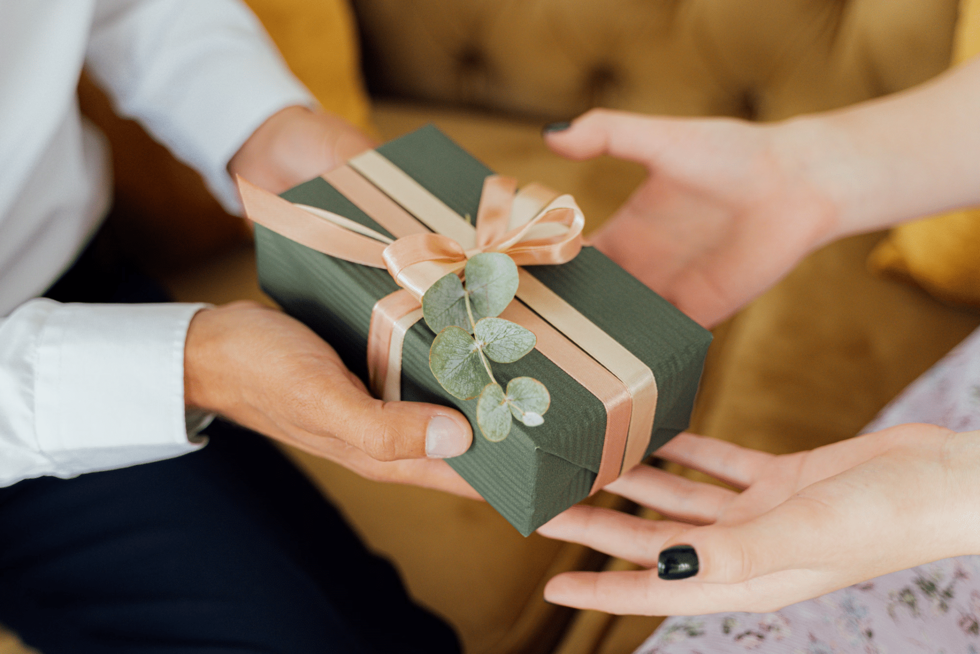 A man giving an expensive gift to a woman.
