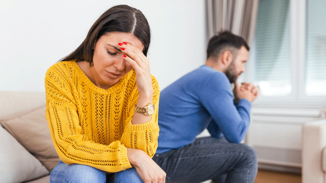 A woman looking upset at her husband