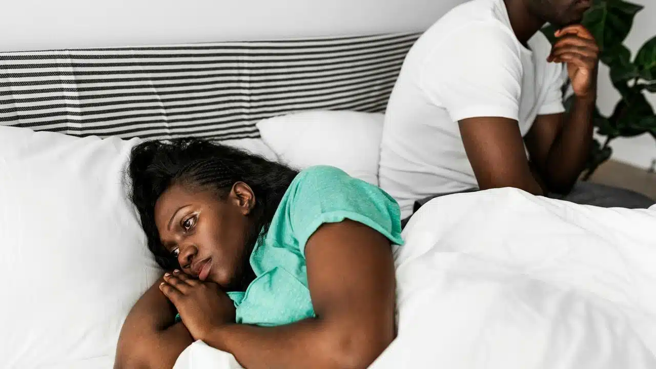A couple ignoring each other.