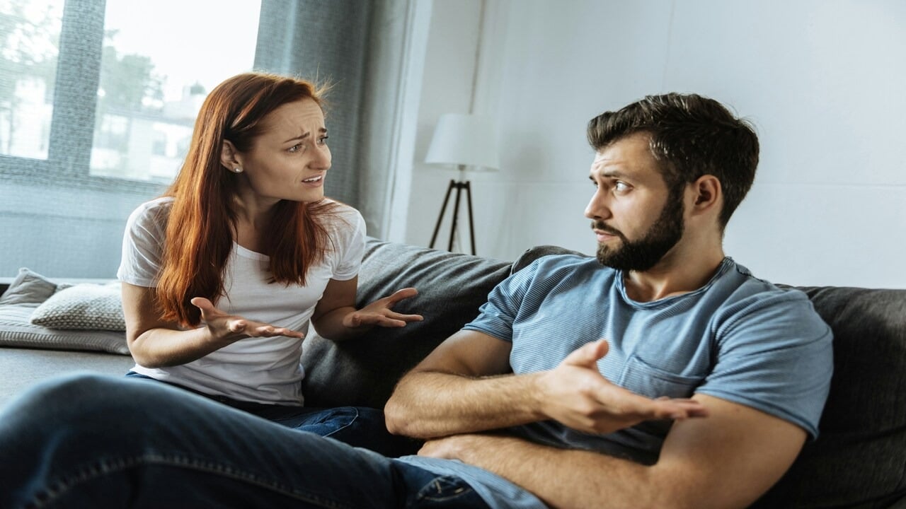 A woman confronting her confused boyfriend