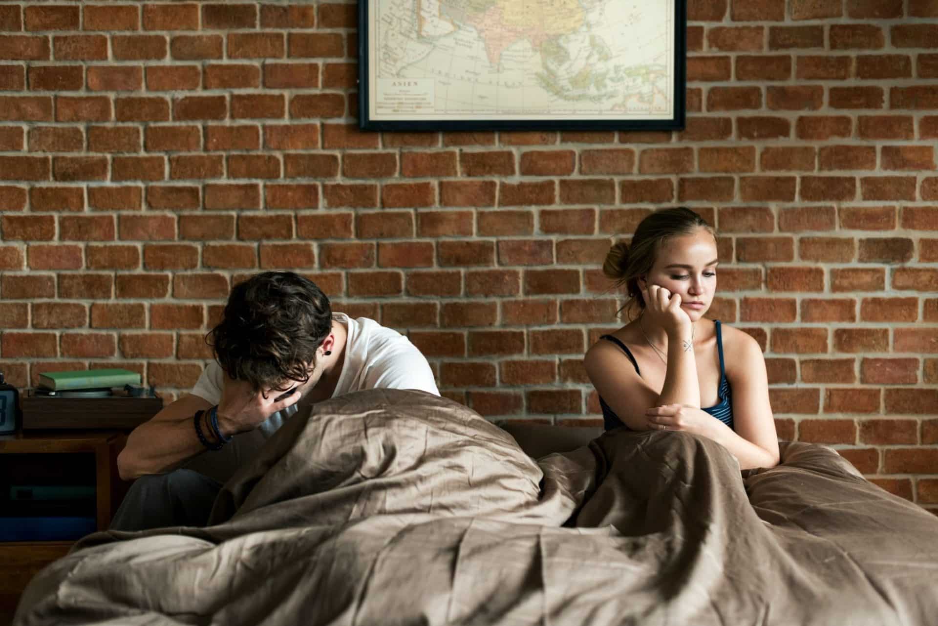 A man and woman at the bed
