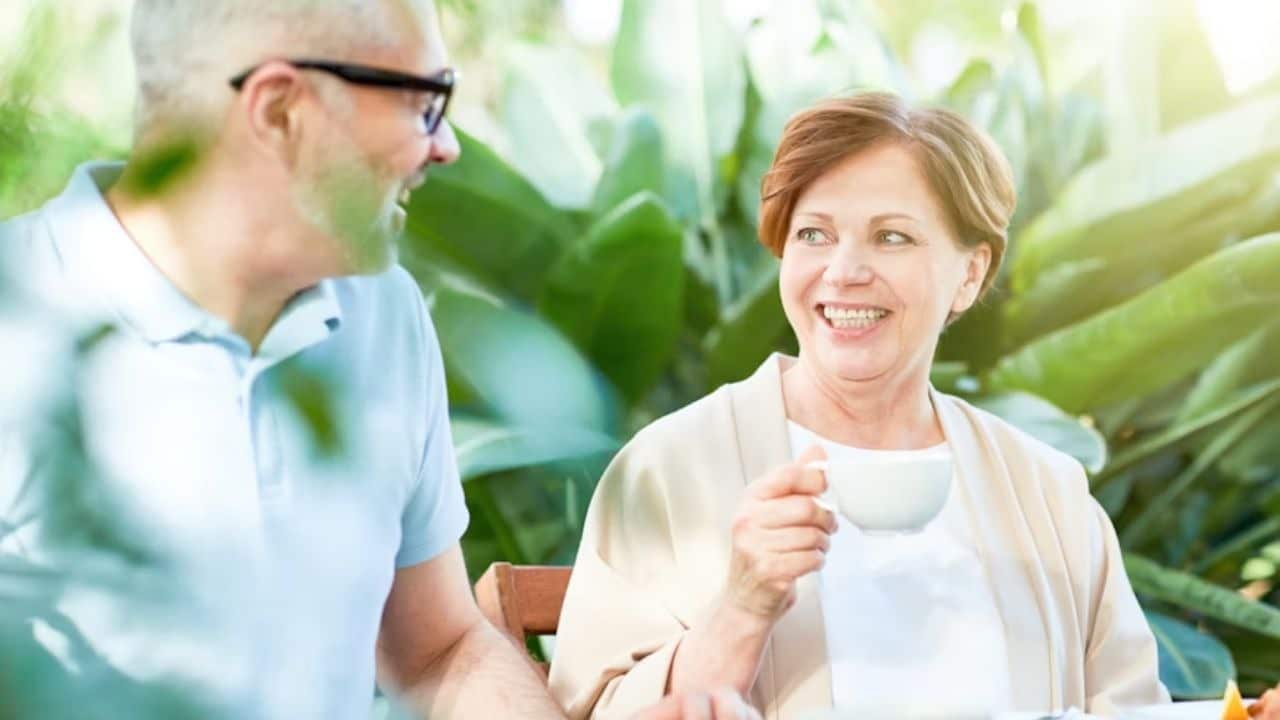 Mature man smiling while on a relaxed date