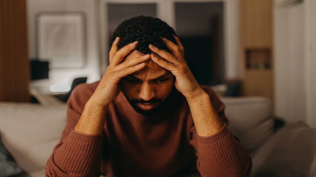 A man looking shocked and upset