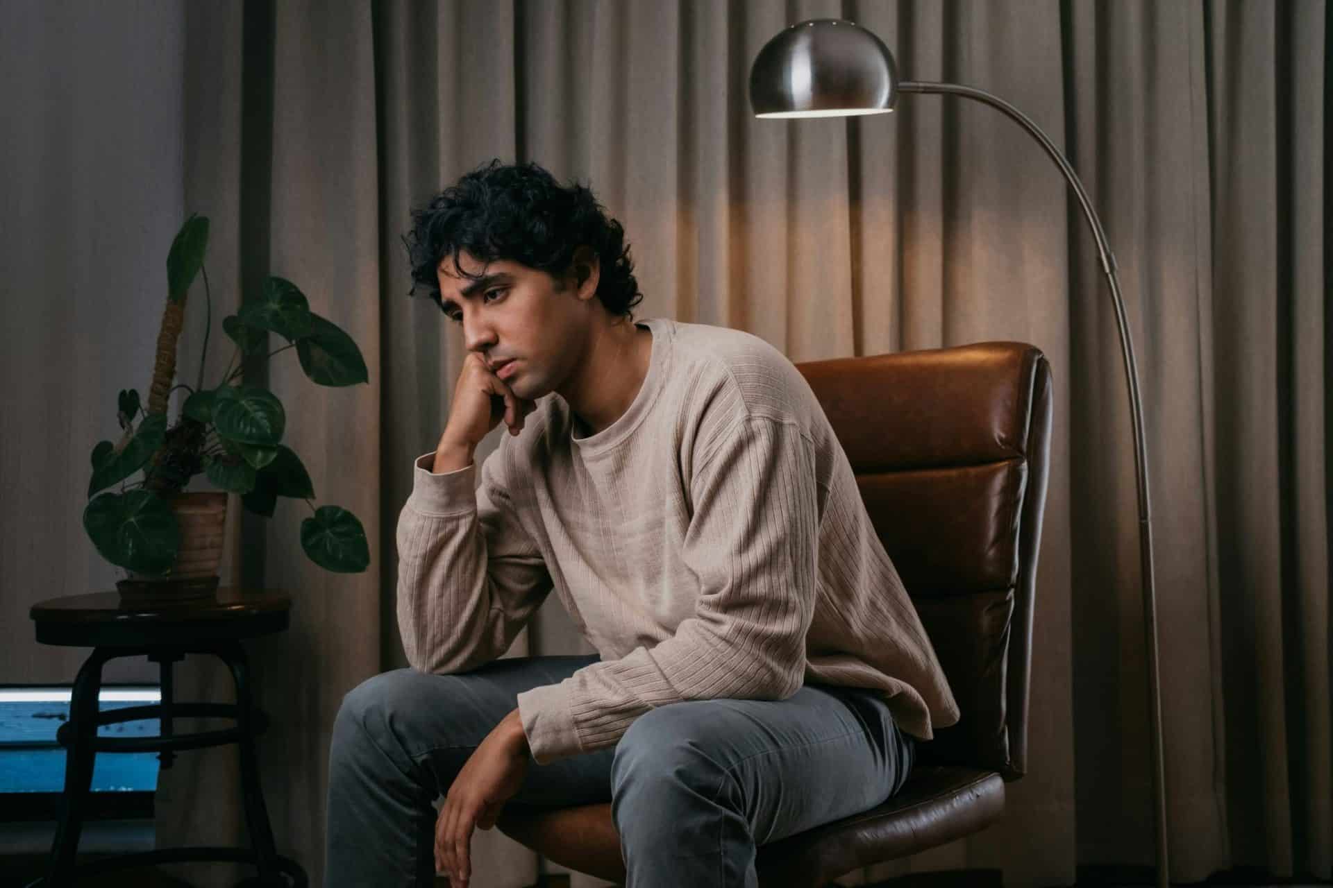 A man looking sad because of his thoughts