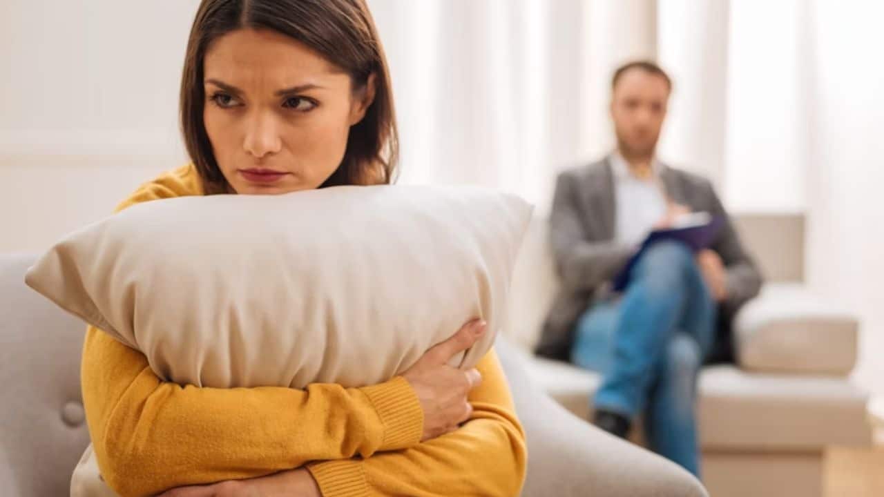 A wife rolling her eyes as her husband talks