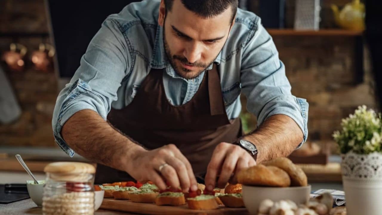Man preparing a surprise dinner setup at home