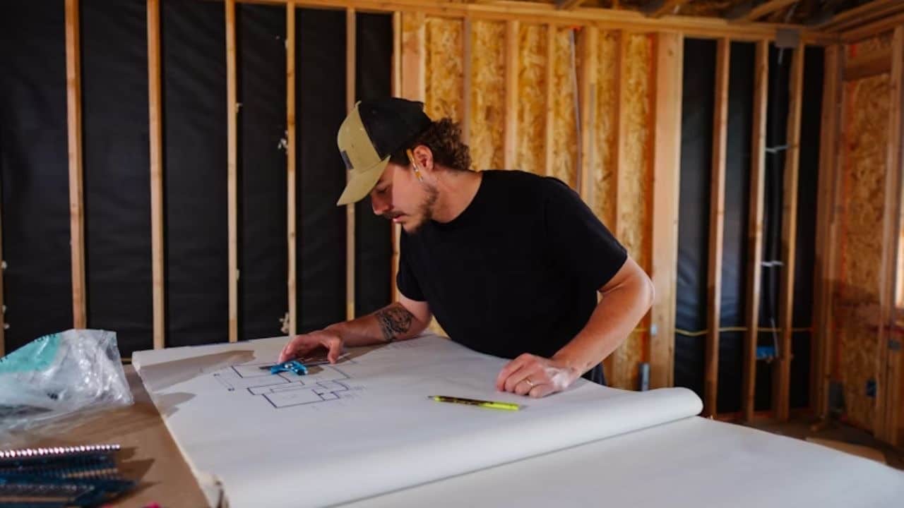 Man working on a creative project in a focused workspace