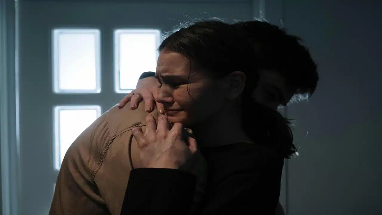 A man comforting his crying girlfriend