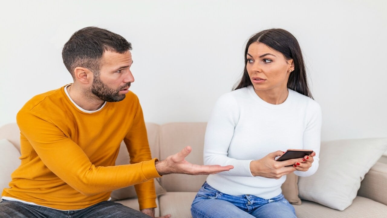 A man asking who his girlfriend is texting