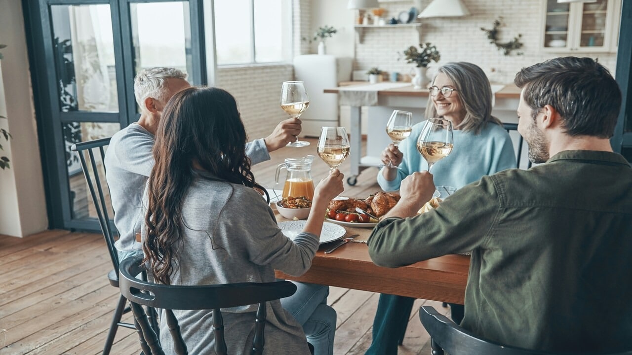 A couple spending time with one of their parents