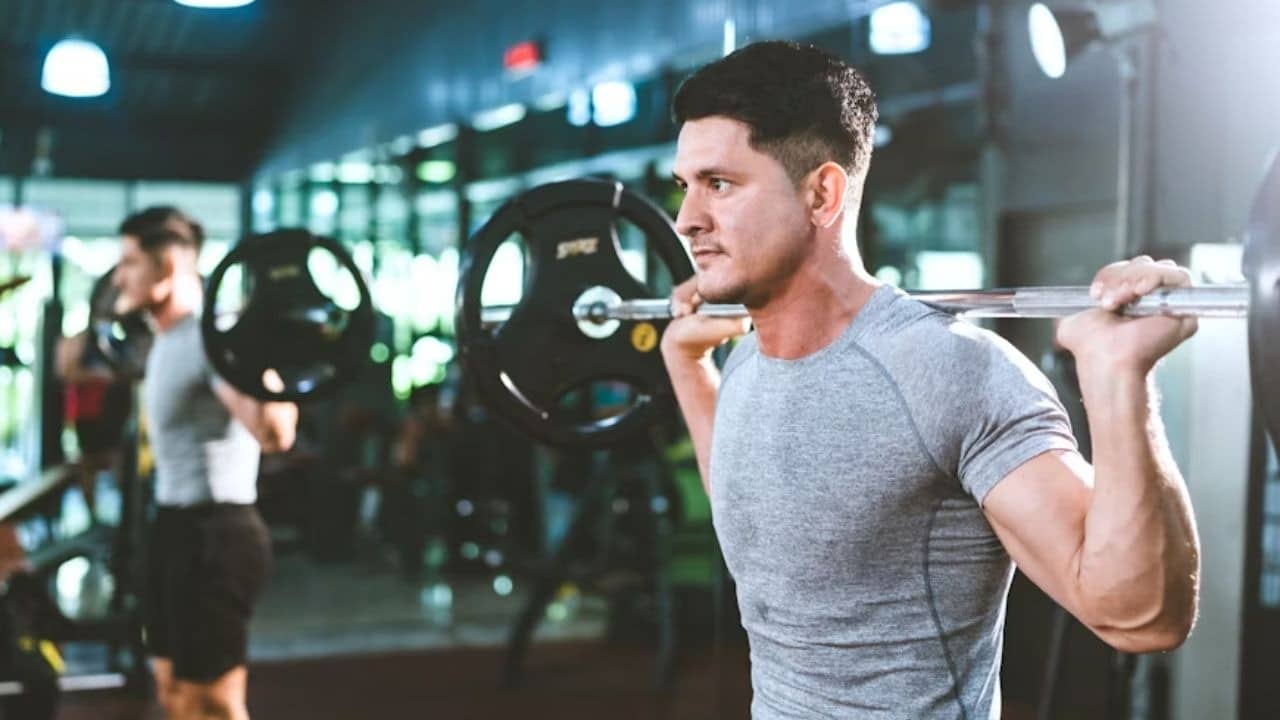 Man training with weights in the gym