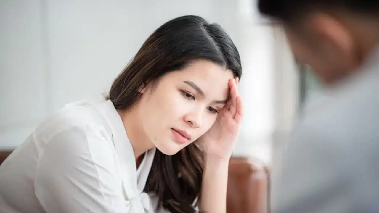 Woman staring down during an argument