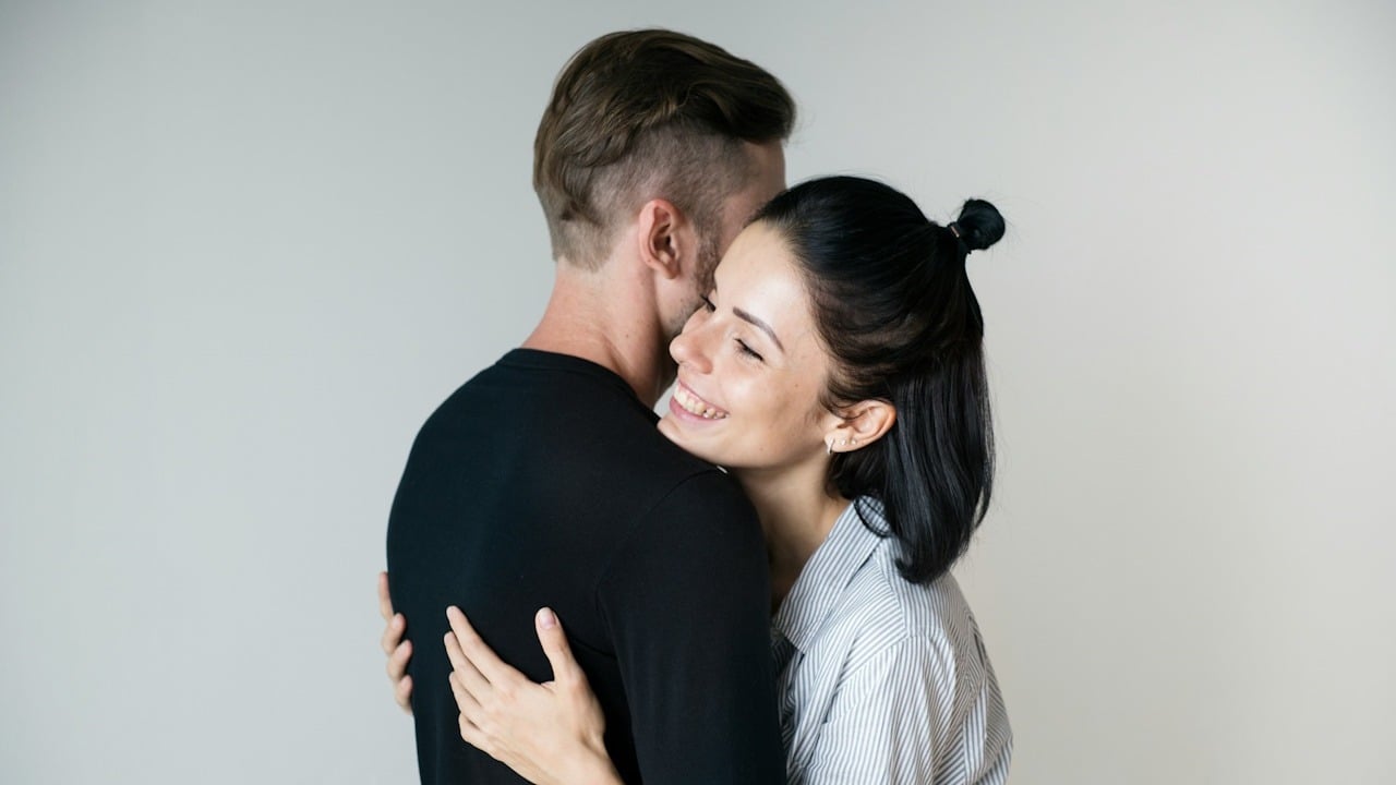 A couple hugging each other.