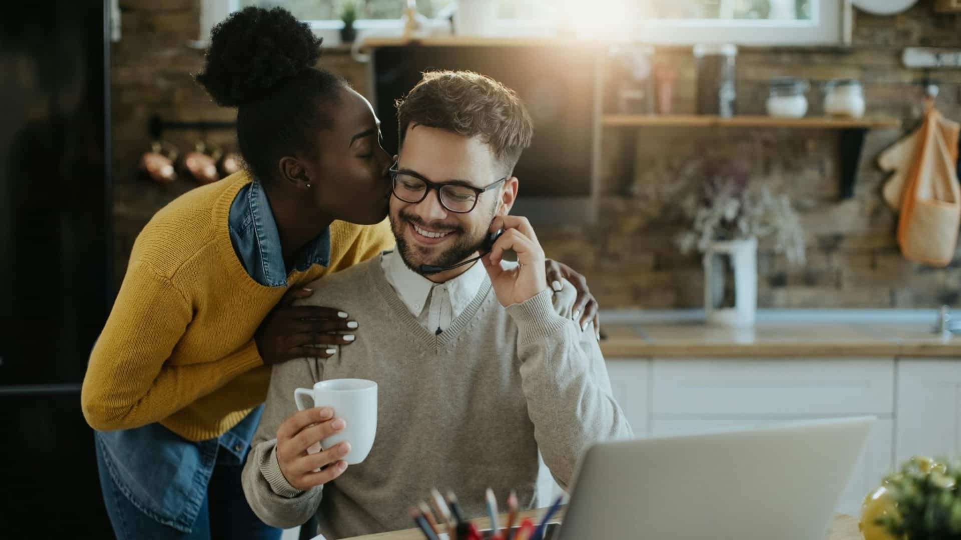 Woman kissing man’s cheek
