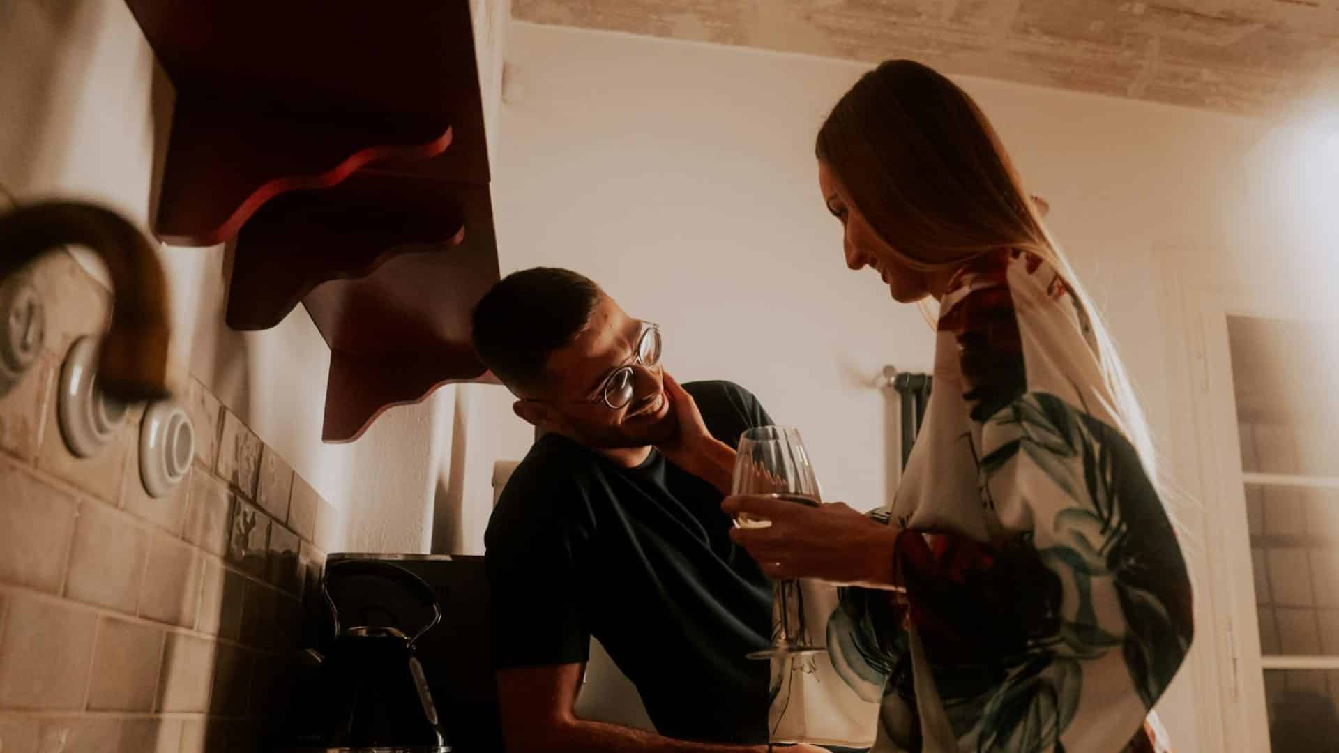Woman holding man’s face