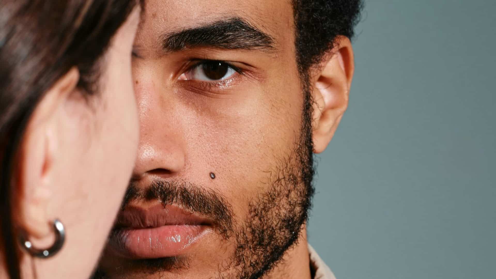 A woman’s face closed to a man’s face