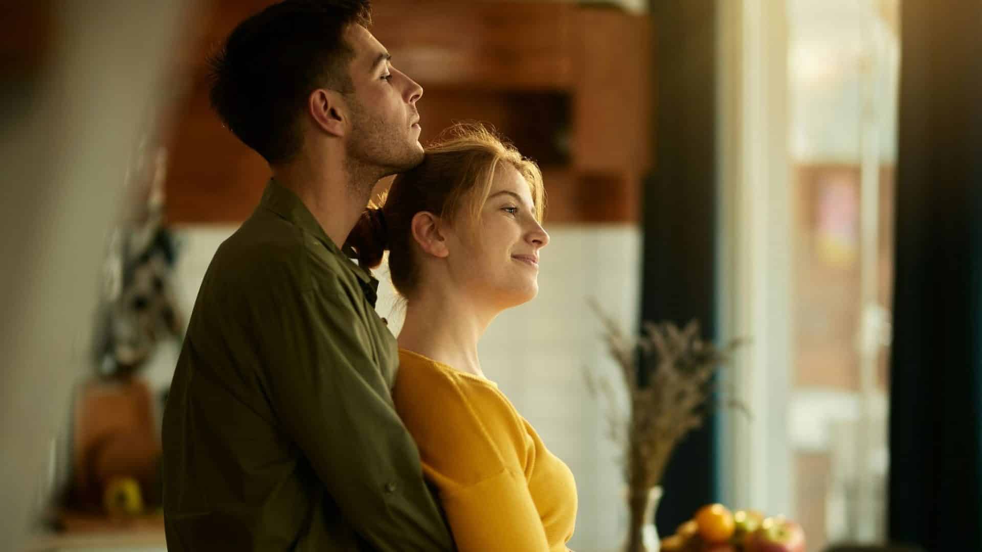 A man hugging a woman