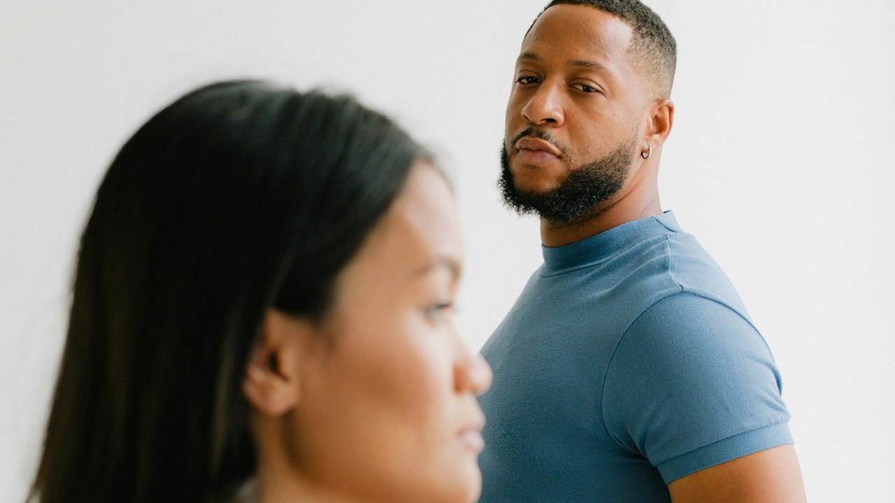 A man and a woman standing next to each other.