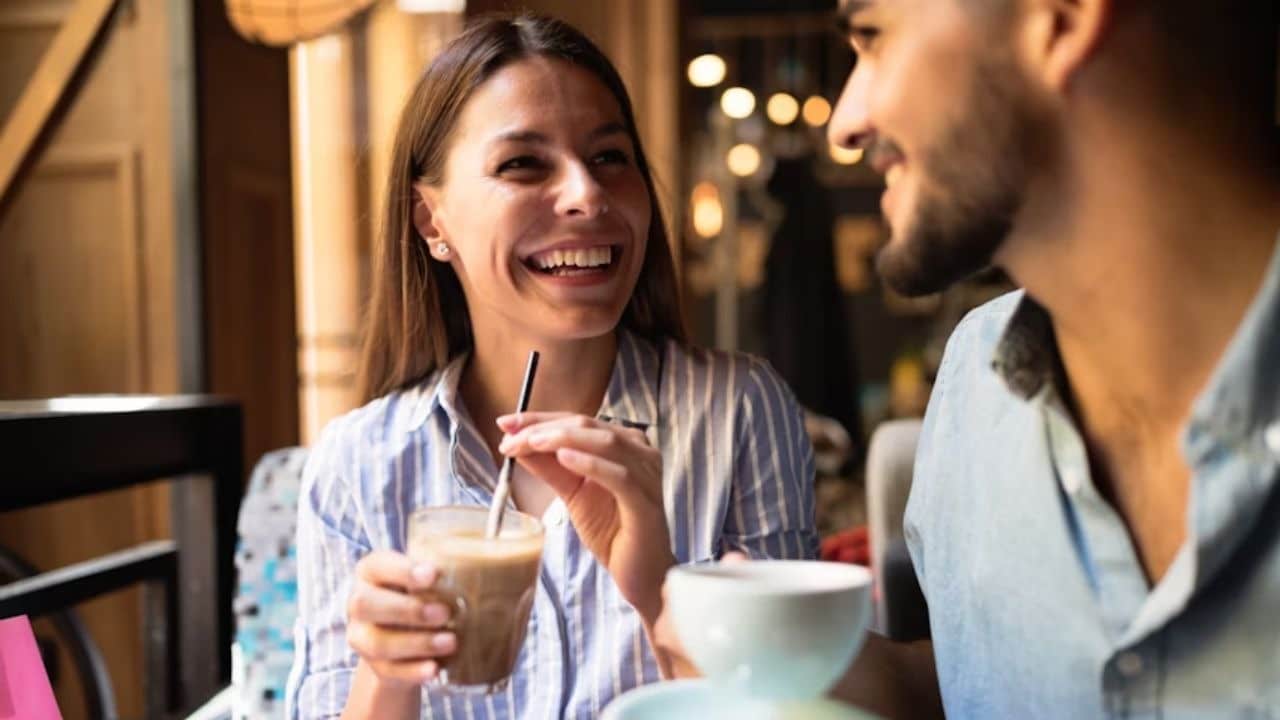 Man and woman sharing a deep conversation over coffee