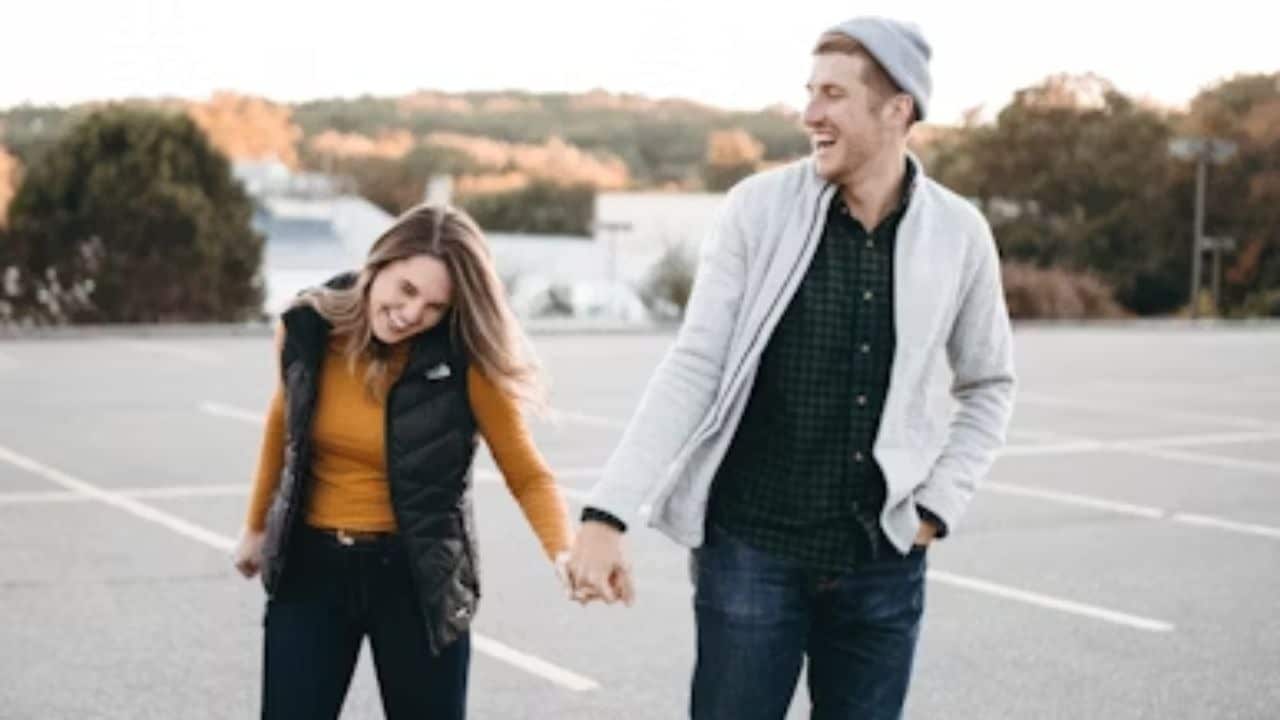 Couple laughing together during a walk