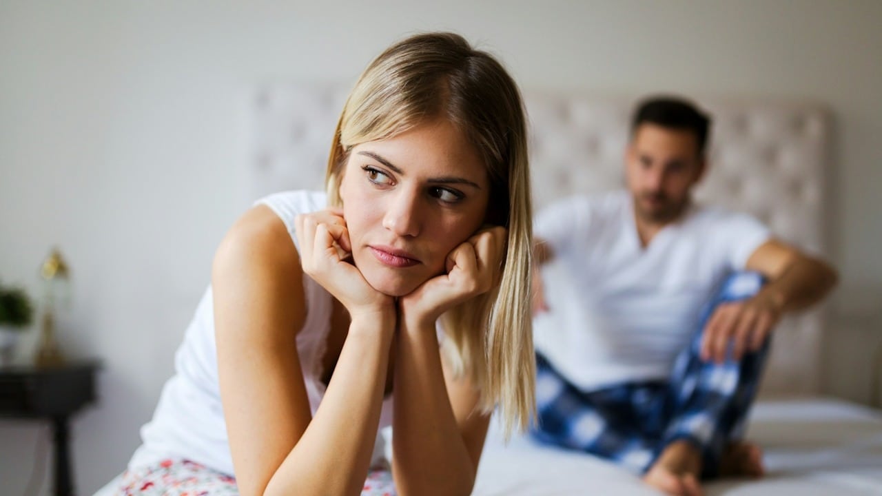A young, unhappy couple having problems in their relationship.