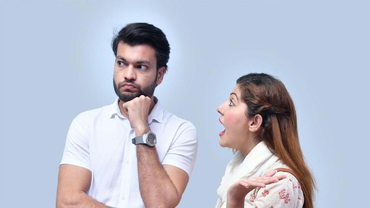 A man and a woman arguing with each other.
