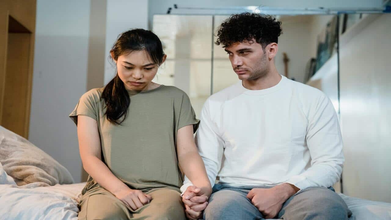 A couple looking upset while talking