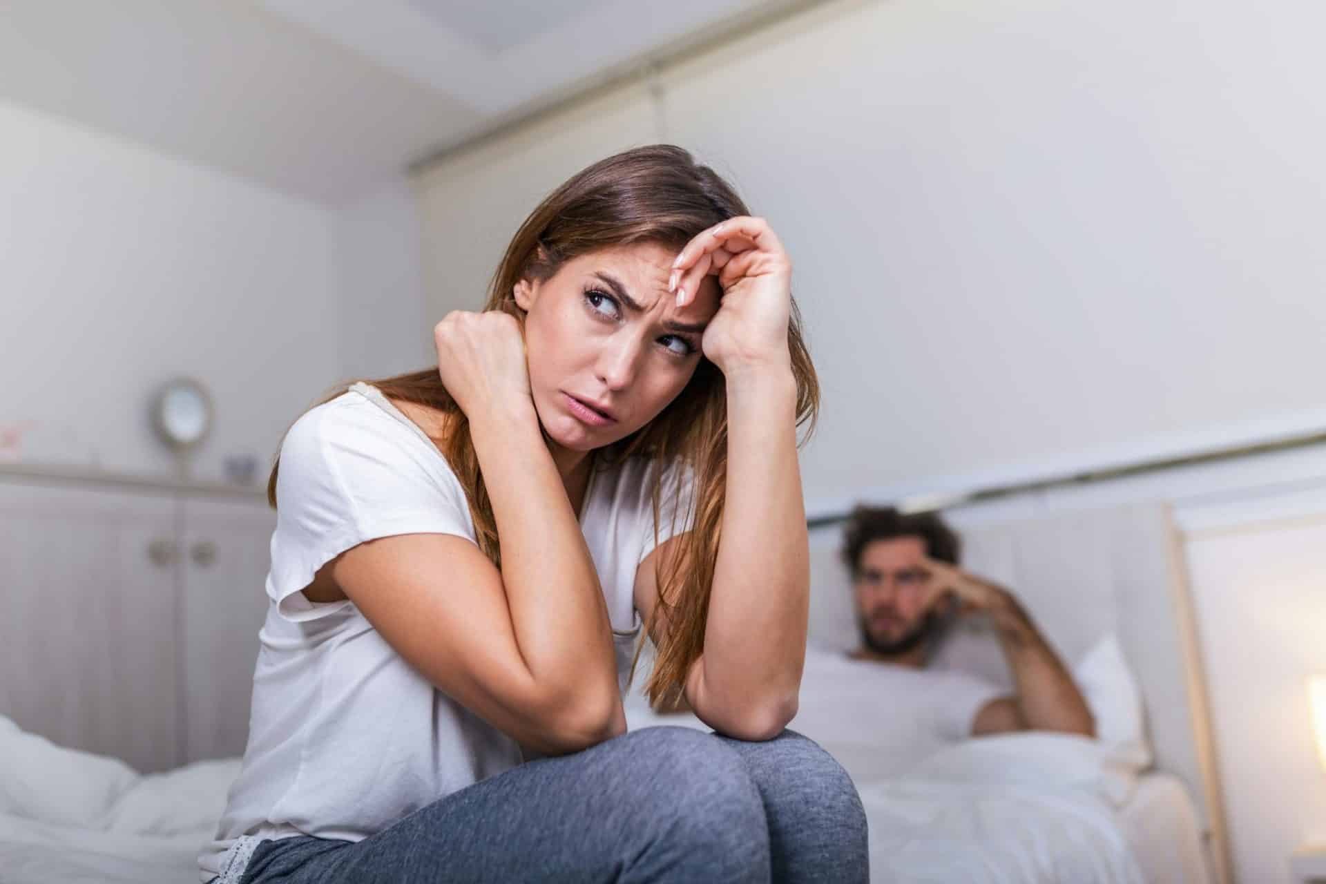 A man being silent behind the woman