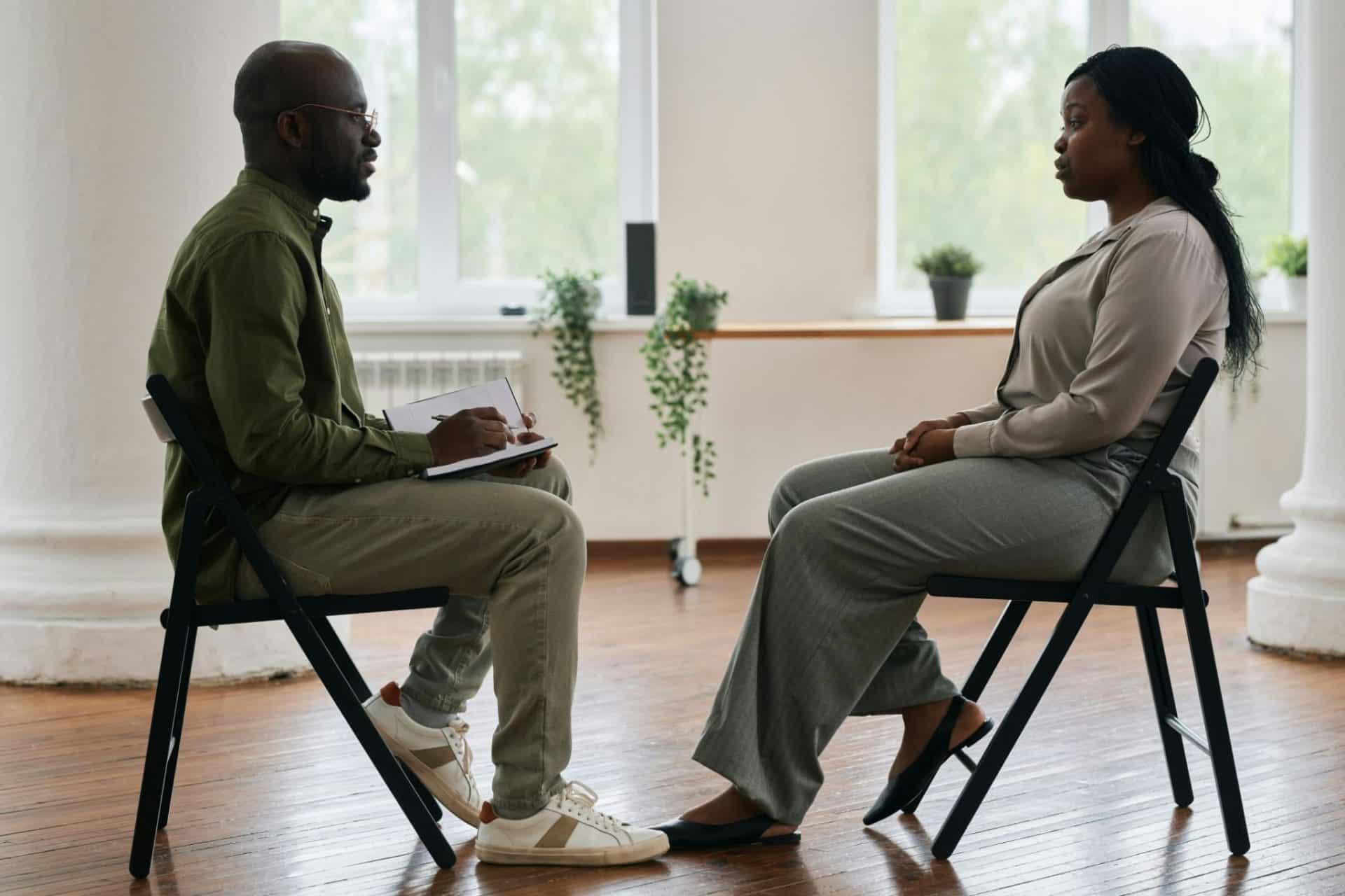 A woman listening to a man