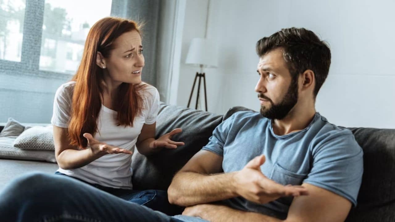 Couple sitting face to face during a mild argument