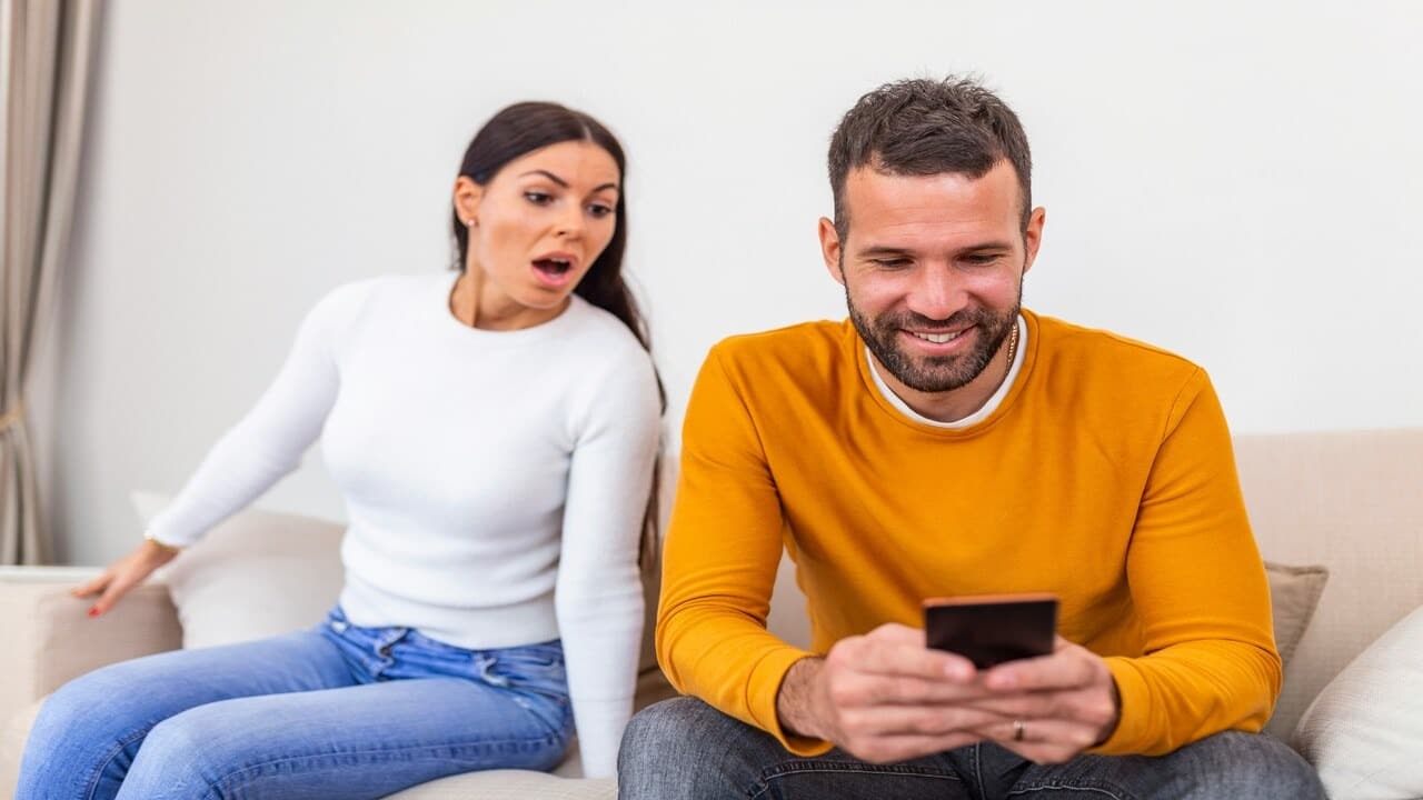 A woman jealous at who her man is texting