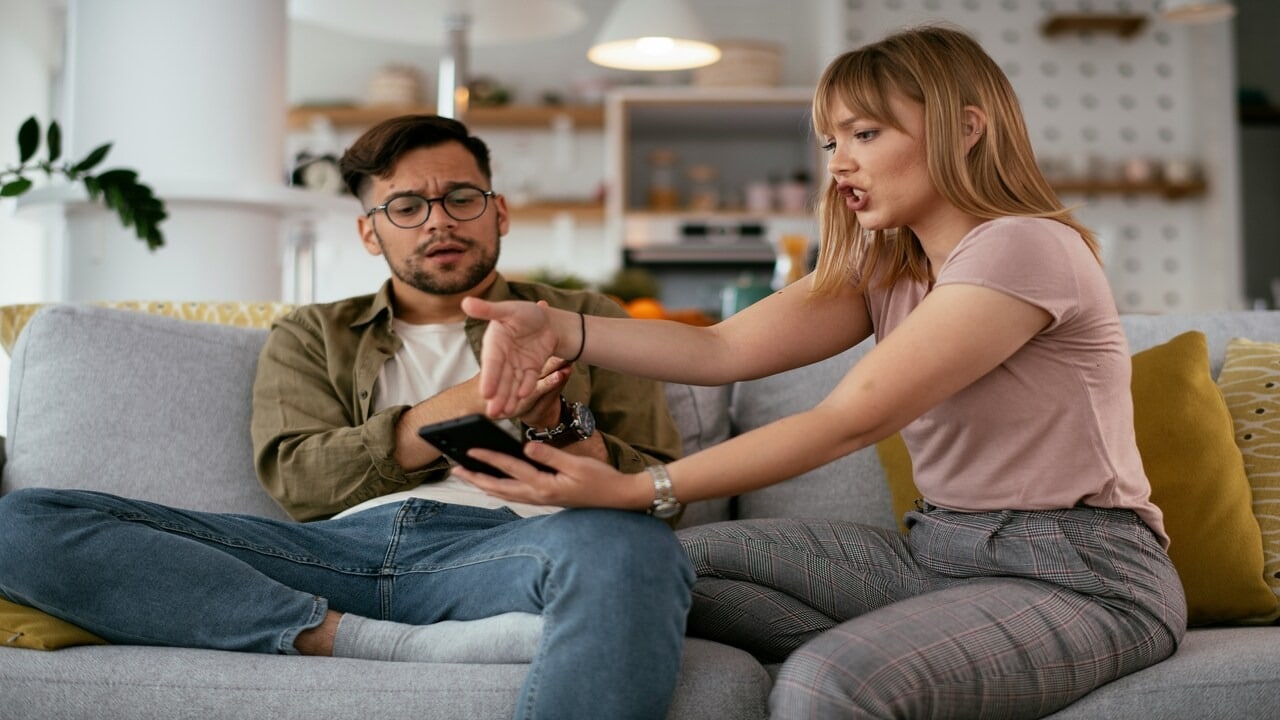 A woman yelling at her boyfriend about something on the phone