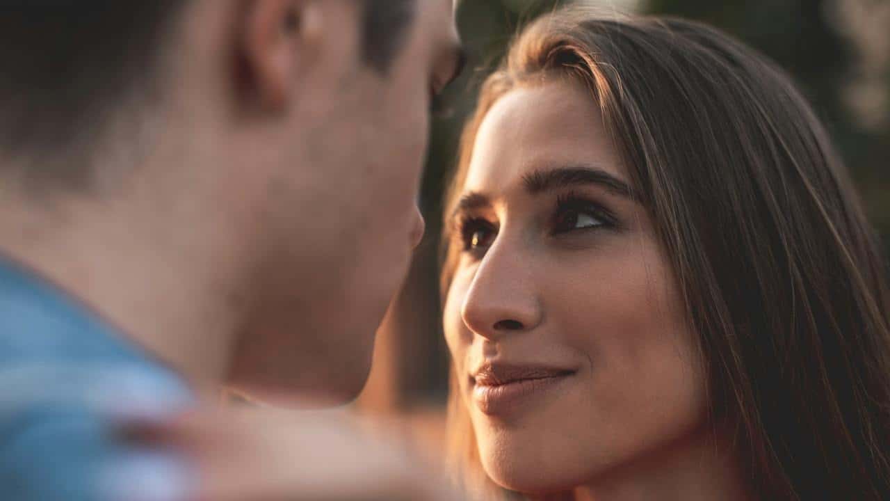 A young man and a woman looking at each other with love.