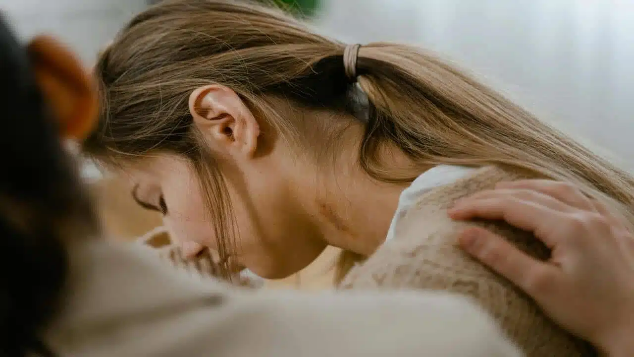 A person comforting a sad friend