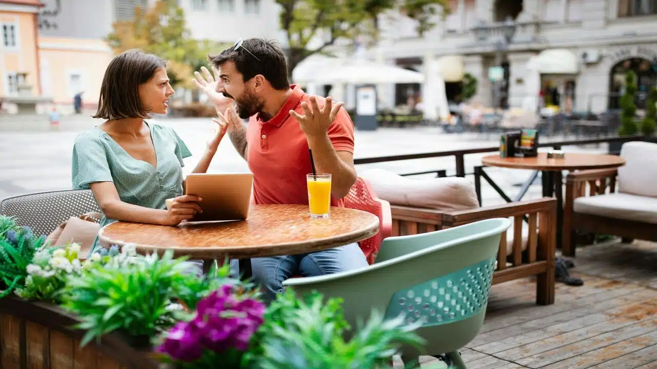 A couple yelling at each other outdoors