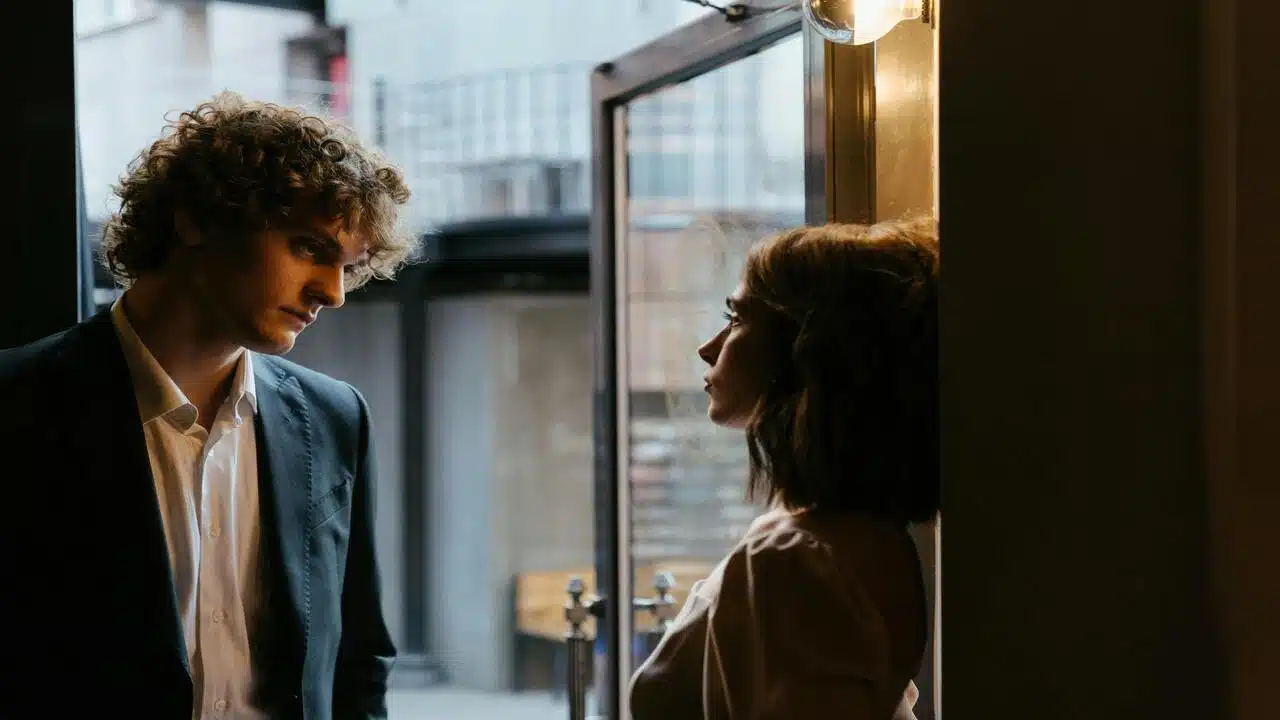 A couple talking by the window