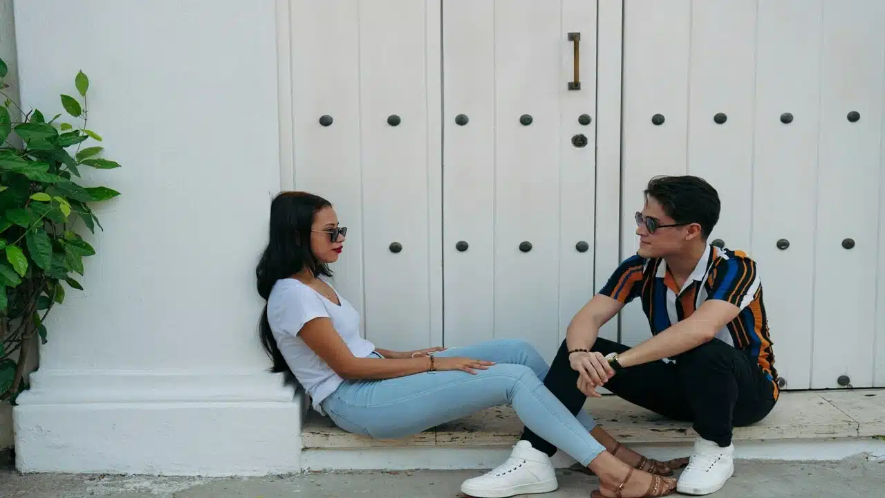A couple talking outdoors