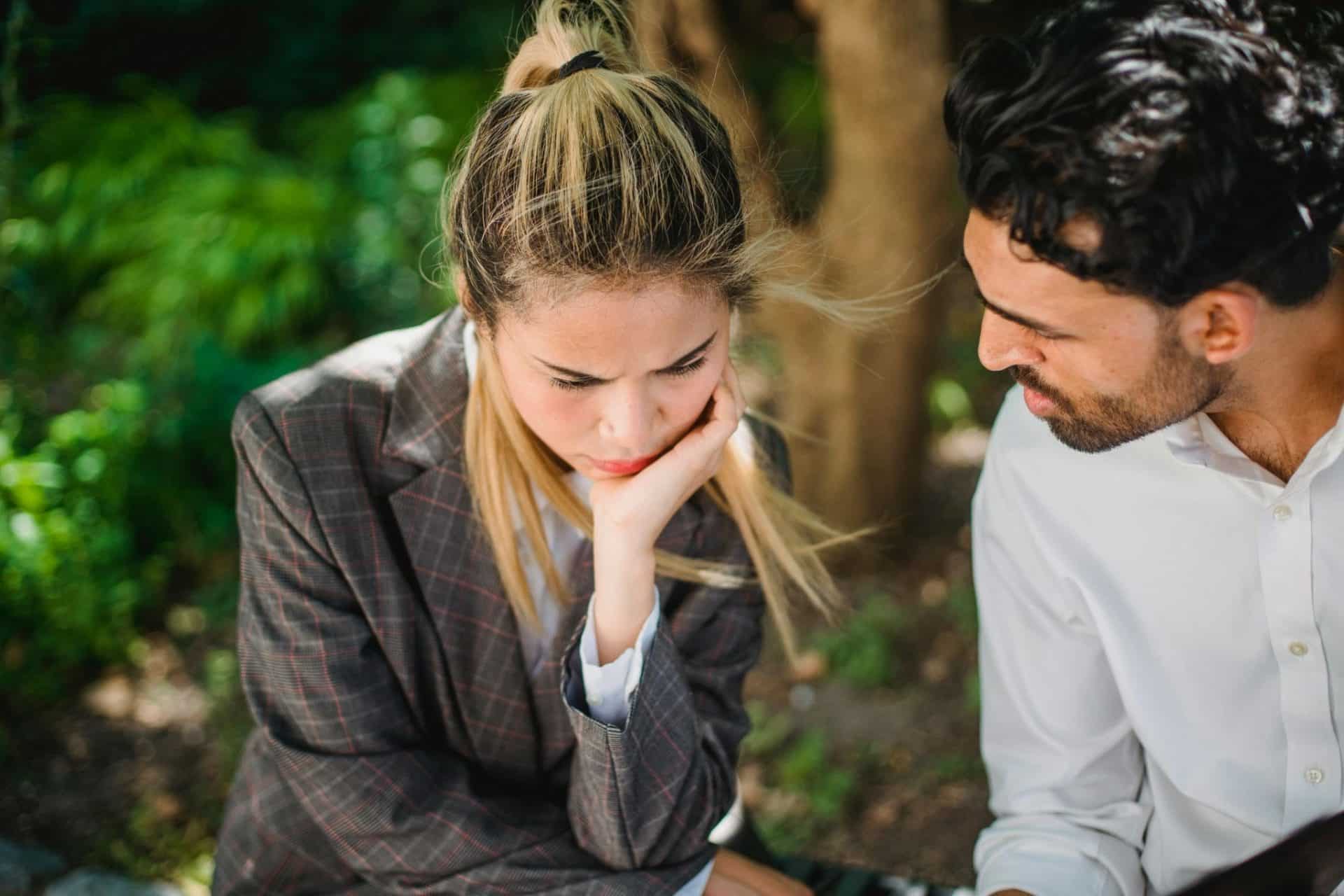 A man trying to speak with woman
