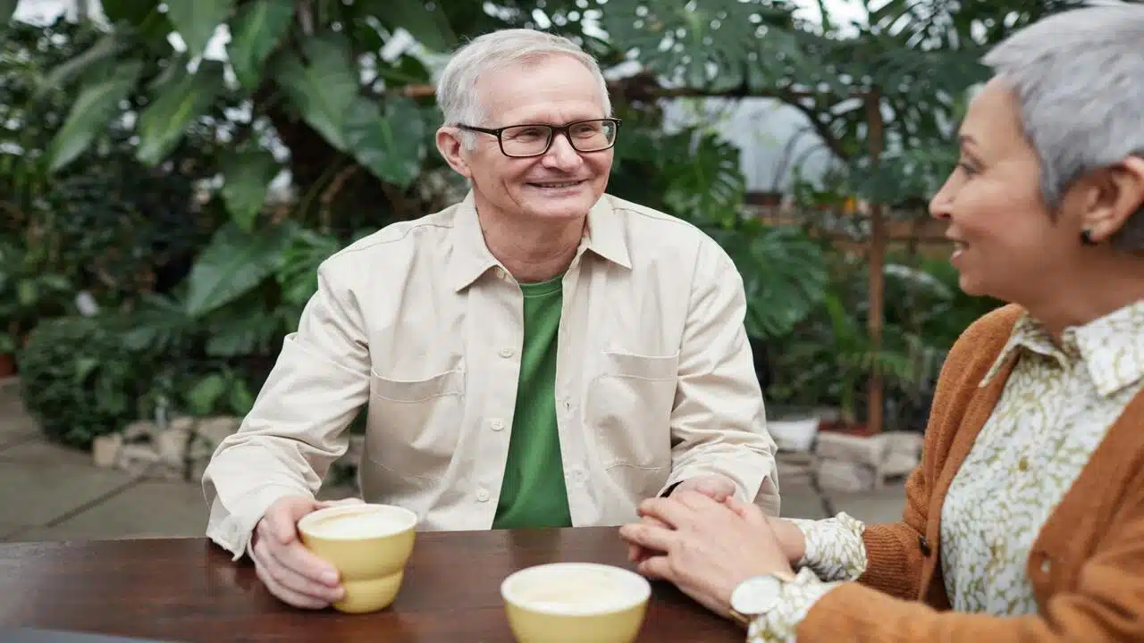 A mature couple smiling at each other