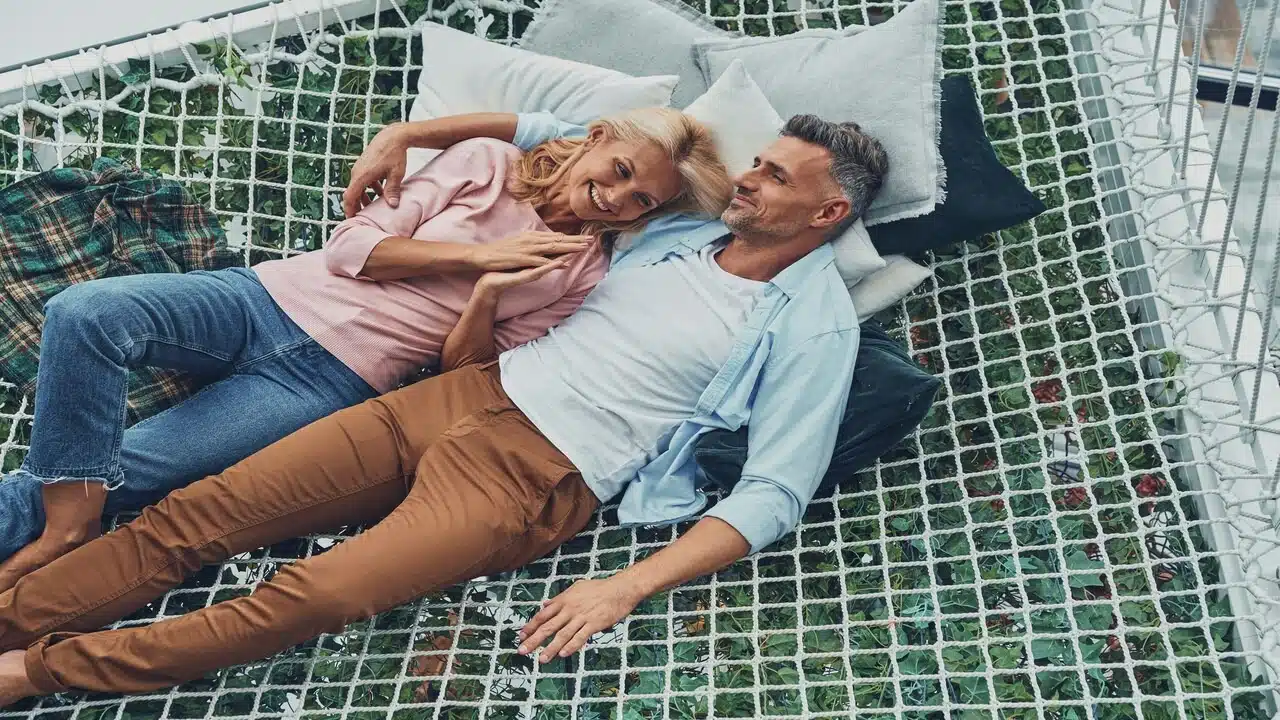 A mature couple on a hammock