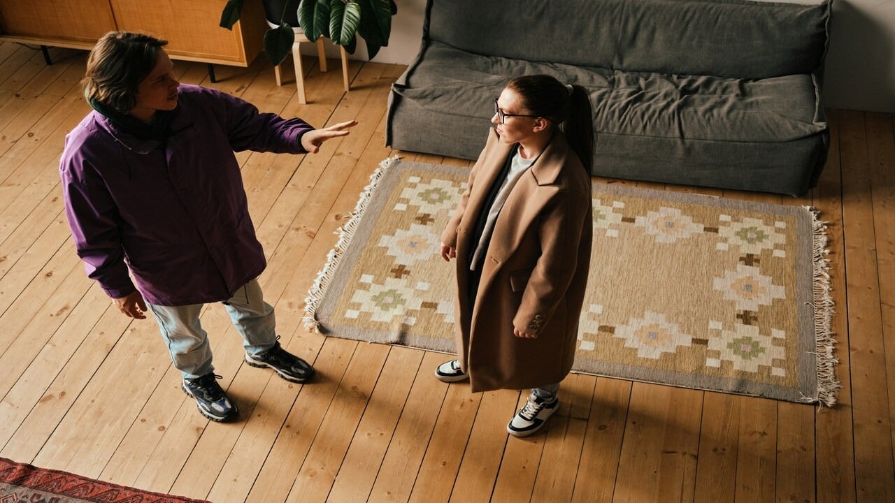 A couple arguing in the living room