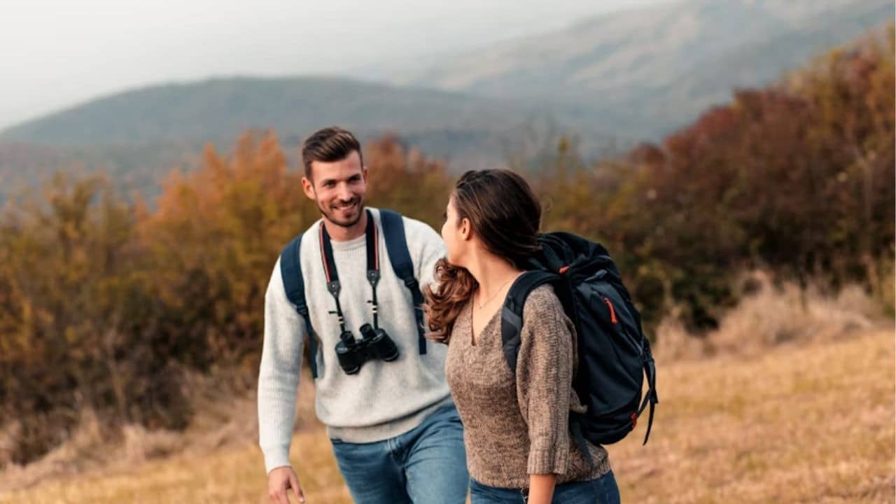 Couple hiking together on a scenic trail