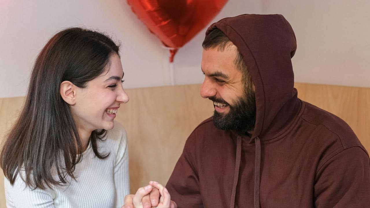 A couple laughing together.