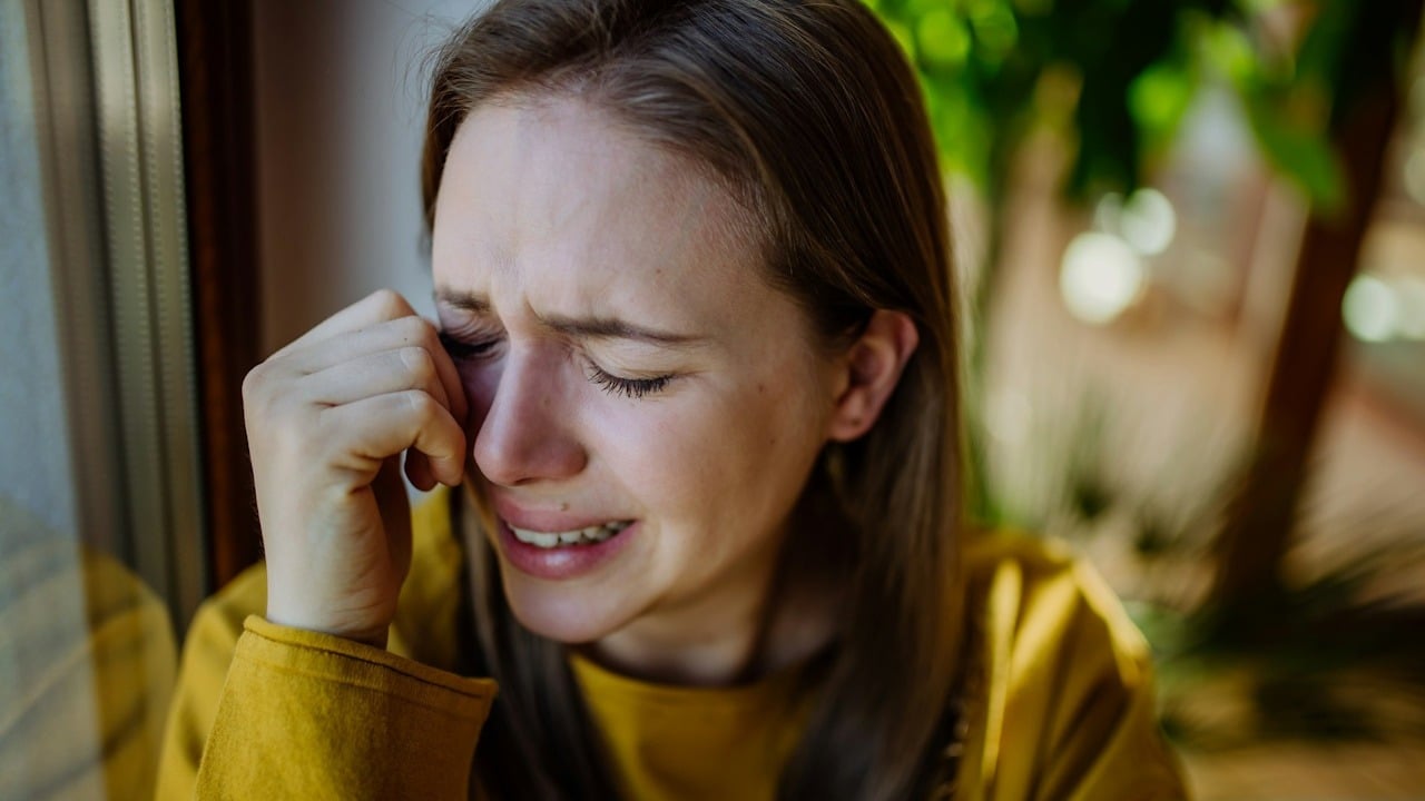 A woman crying.